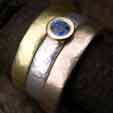 sapphire engagement ring with gold rings