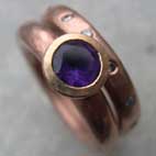 Amethyst set in red gold ring with a red gold diamond eternity ring
