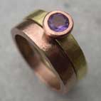 Amethyst engagement band with a red gold wedding ring