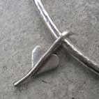 silver heart leaf charm on silver bangle 