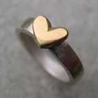 18ct gold heart on silver band