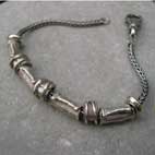 designer silver beads on bracelet