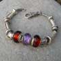 beaded bracelet with red glass and silver beads