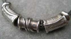 three silver beads  detail