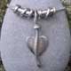 Silver leaf pendant with twist beads