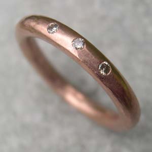 red gold half eternity ring