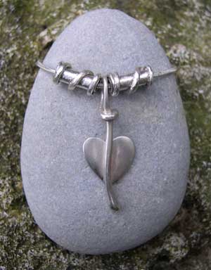 Silver leaf pendant with twist beads