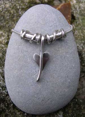 Small silver heart pendant with twist beads