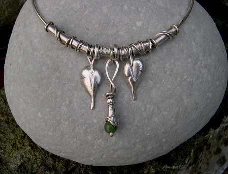 Carved leaf charmm necklace with a jade drop pendant