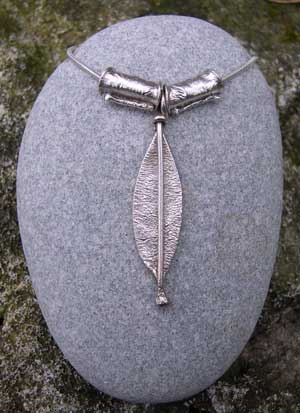 Silver leaf pendant with 2 textured beads