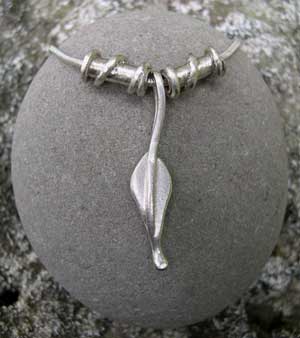 Small silver leaf pendant with 2 twist beads