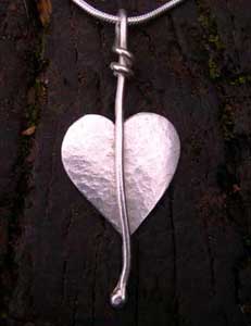 a handmade silver heart pendant