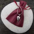 silver leaf pendant with burgandy satin pouch