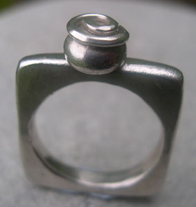 square silver ring with spiral