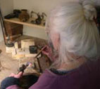 sue yeoman making charm bangles in the workshop